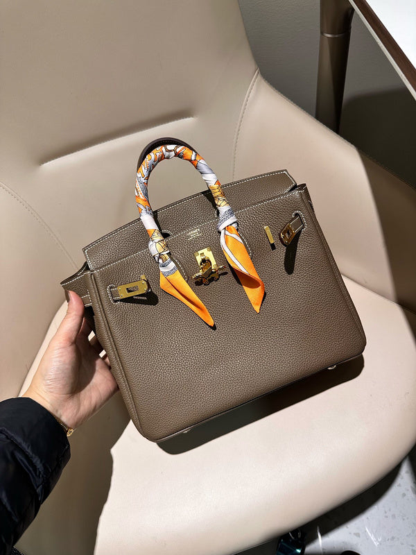 Side view of streamlined structured handbag