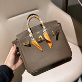 Side view of streamlined structured handbag