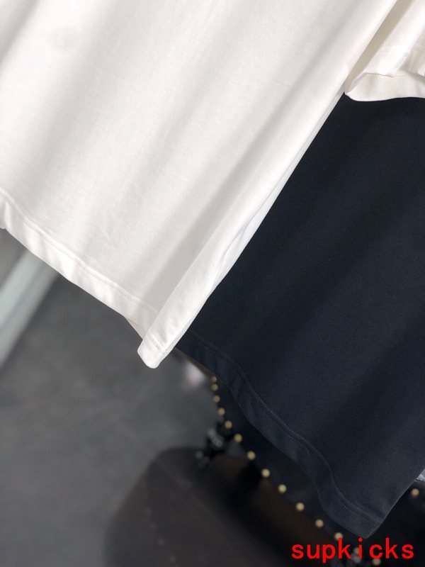 Flat lay presentation of Moncler luxury clothing with relaxed-fit cut