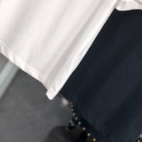 Flat lay presentation of Moncler luxury clothing with relaxed-fit cut