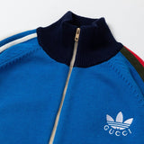 Close-up detail shot of Gucci luxury clothing with logo-detail design