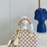 Side profile of statement elevated women's handbag – women's statement bag
