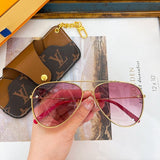 Close-up detail view of Louis Vuitton unisex sunglasses
