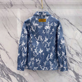 Close-up detail shot of Louis Vuitton luxury clothing with label-forward styling