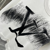 Flat lay presentation of Louis Vuitton luxury clothing with relaxed-fit cut