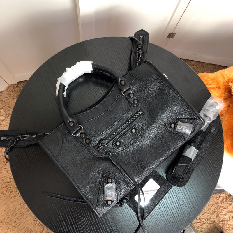 Styled lifestyle shot of structured polished women's handbag – women's luxury handbag