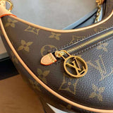Handle and strap detail of sleek classic women's handbag – women's designer-style accessory