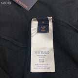 Close-up detail shot of Louis Vuitton luxury clothing with contemporary cut
