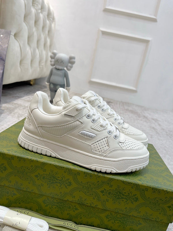 Gucci Designer sneakers in muted earth tones retro runner design front view