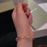 Side view of Van Cleef & Arpels unisex jewelry piece