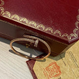 Side view of Cartier unisex jewelry piece