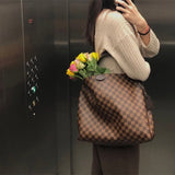  Understated crossbody bag carried on shoulder 22