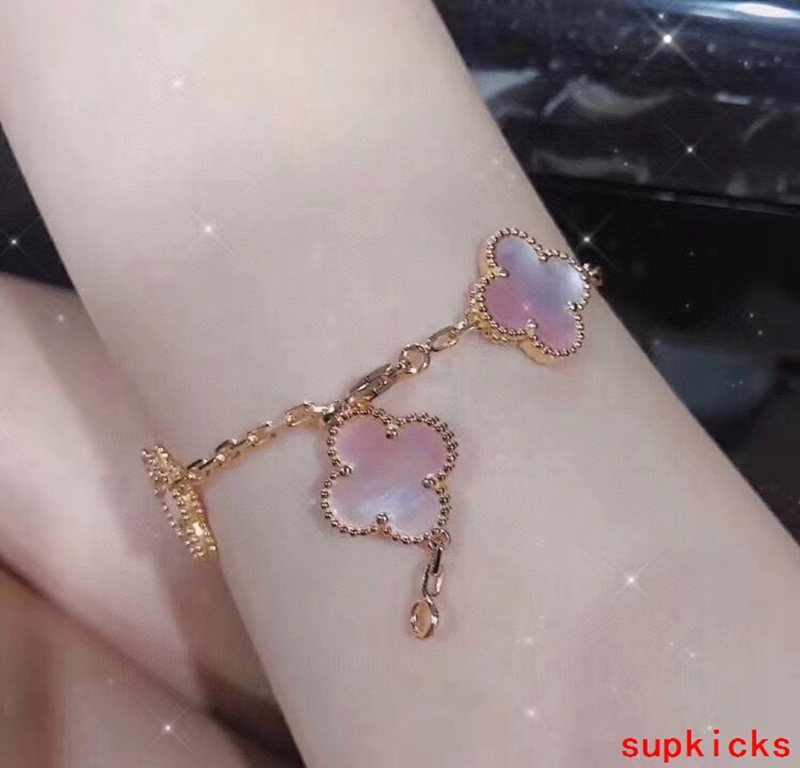 Lifestyle view of Van Cleef & Arpels unisex jewelry piece