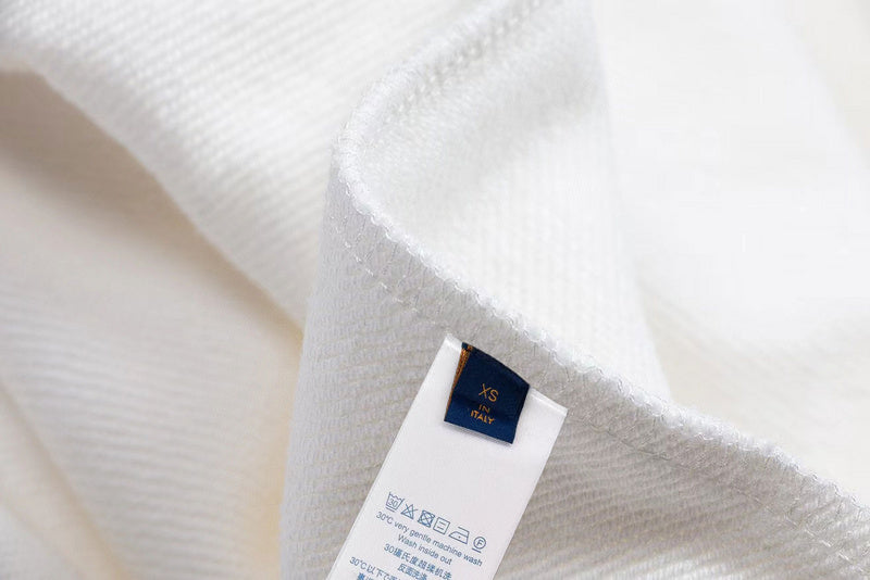 Close-up detail shot of Louis Vuitton luxury clothing with everyday silhouette
