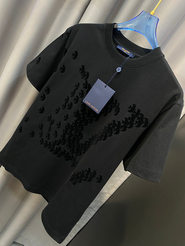 Close-up detail shot of Louis Vuitton cotton t-shirt with signature branding