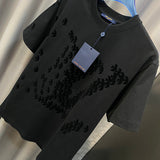 Close-up detail shot of Louis Vuitton cotton t-shirt with signature branding