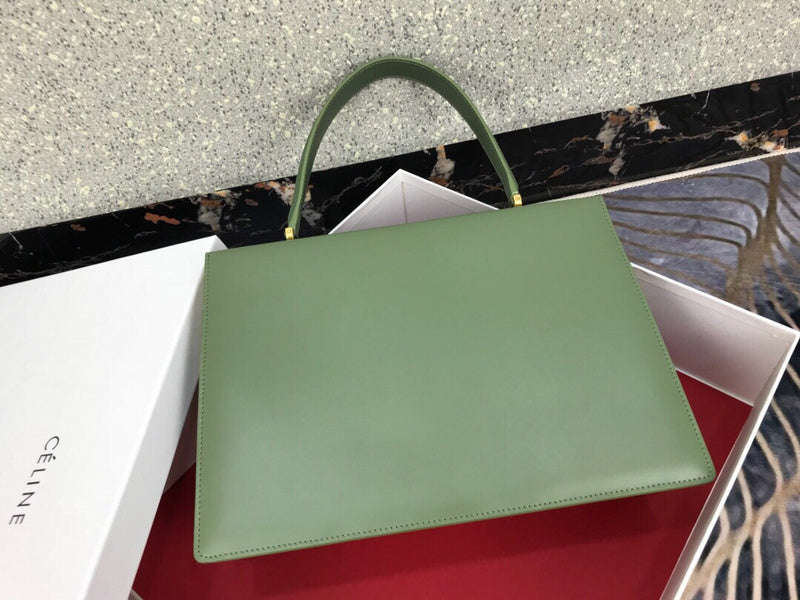 Styled lifestyle shot of everyday-luxe structured women's handbag – women's luxury accessory