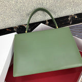 Styled lifestyle shot of everyday-luxe structured women's handbag – women's luxury accessory