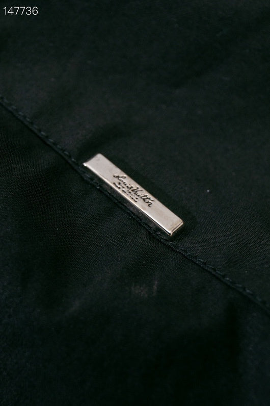 Side profile of Louis Vuitton luxury clothing with monogram-inspired silhouette