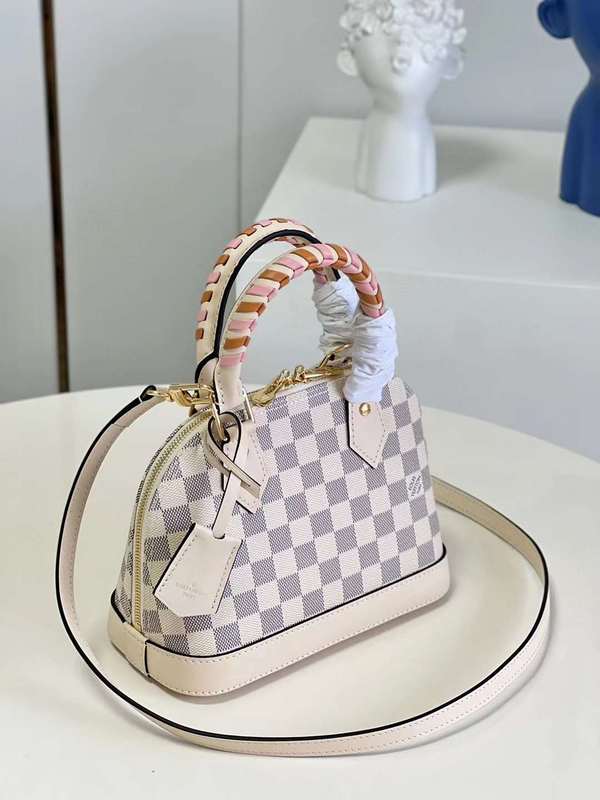 Handle and strap detail of statement elevated women's handbag – women's statement bag
