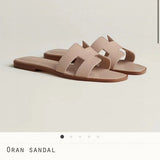 Hermes sandals Style 060 - front view, statement logo accent