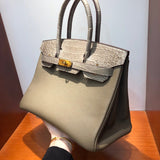 Side view of curated structured handbag