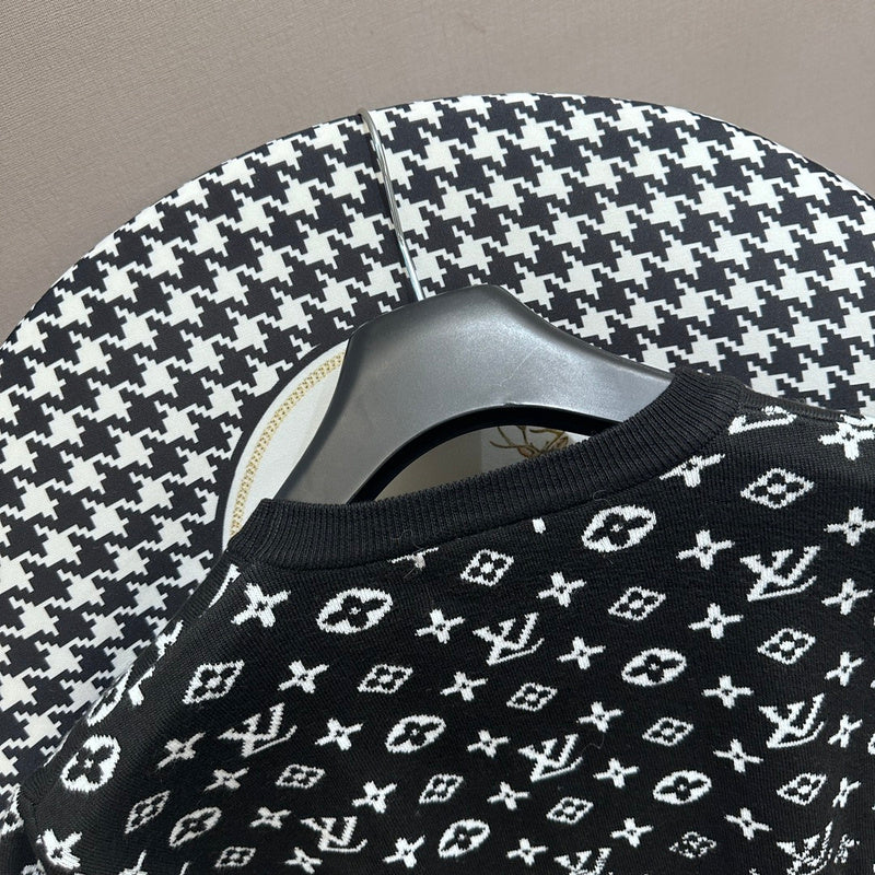 Full styled look of Louis Vuitton luxury clothing with label-forward styling