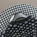 Full styled look of Louis Vuitton luxury clothing with label-forward styling