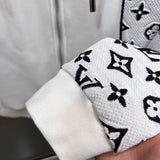 Back view of Louis Vuitton luxury clothing with label-forward styling