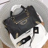 Front view of refined statement women's handbag – women's luxury handbag