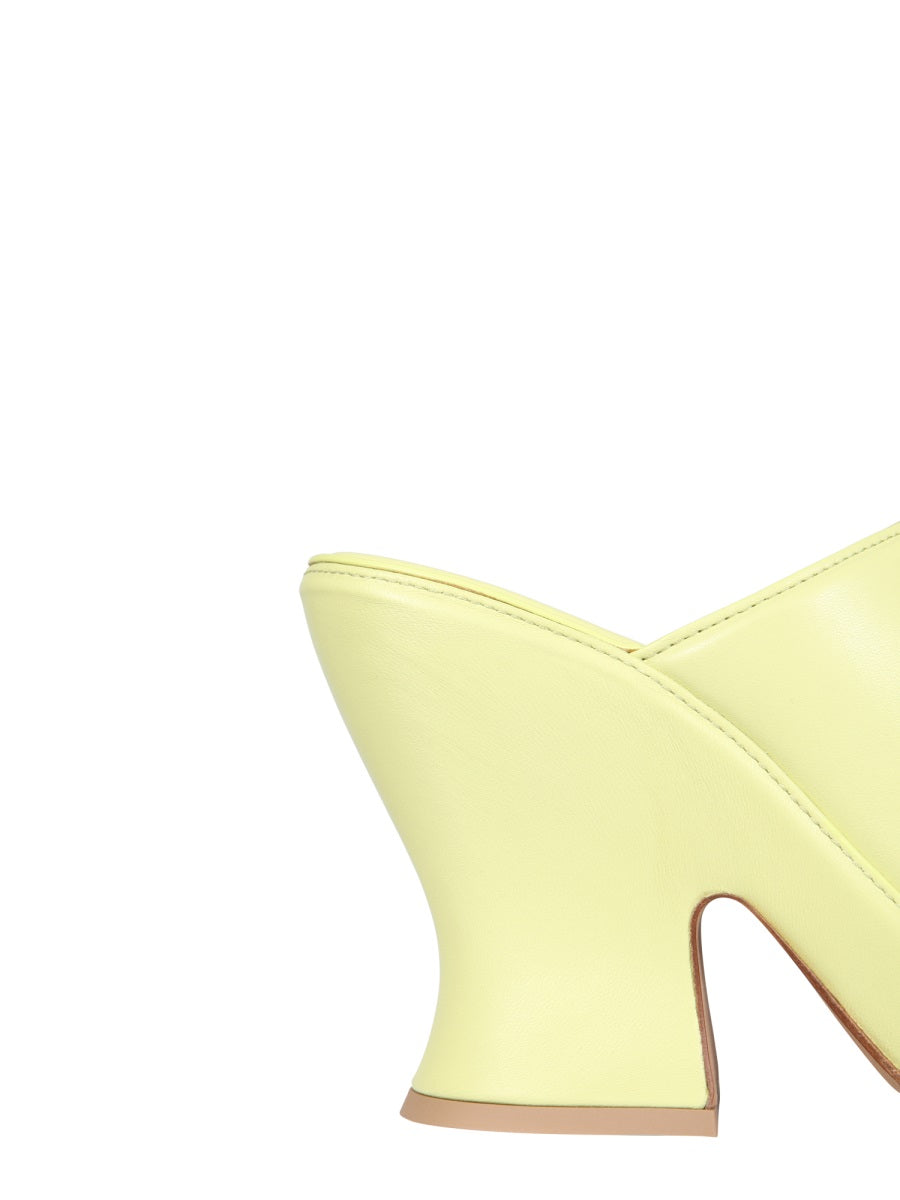 Close-up of Bottega Veneta sandals hardware and fine stitching