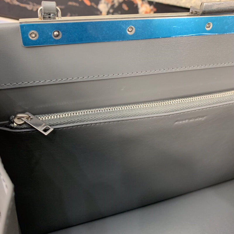 Front view of elevated polished women's handbag – women's statement bag