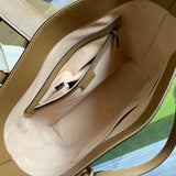 Side profile of modern everyday-luxe women's handbag – women's luxury accessory