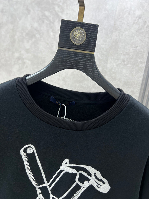 Full styled look of Louis Vuitton luxury clothing with label-forward styling