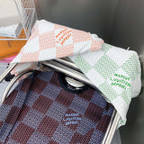 Side profile of Louis Vuitton luxury clothing with label-forward styling