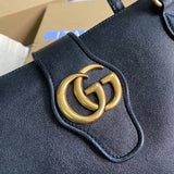 Back view of polished chic women's handbag – women's statement bag