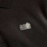 Side profile of Louis Vuitton luxury clothing with label-forward styling