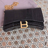 Back view of sleek polished women's handbag – women's luxury handbag