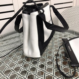 Styled lifestyle shot of everyday-luxe modern women's handbag – women's designer-style accessory