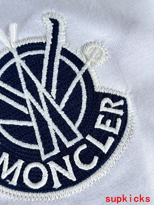 Side profile of Moncler luxury clothing with signature branding