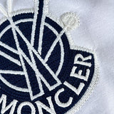Side profile of Moncler luxury clothing with signature branding