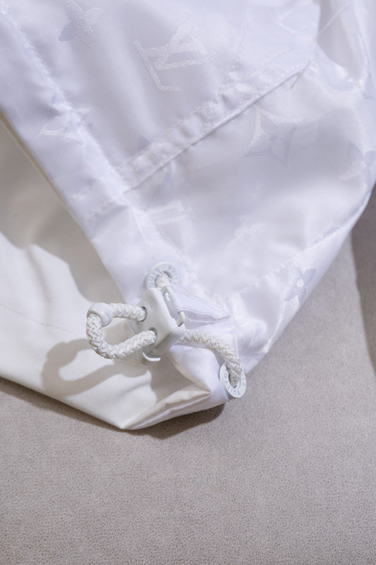 Full styled look of Louis Vuitton luxury clothing with label-forward styling