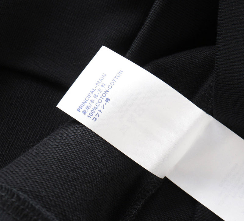 Close-up detail shot of Louis Vuitton luxury clothing with tailored silhouette
