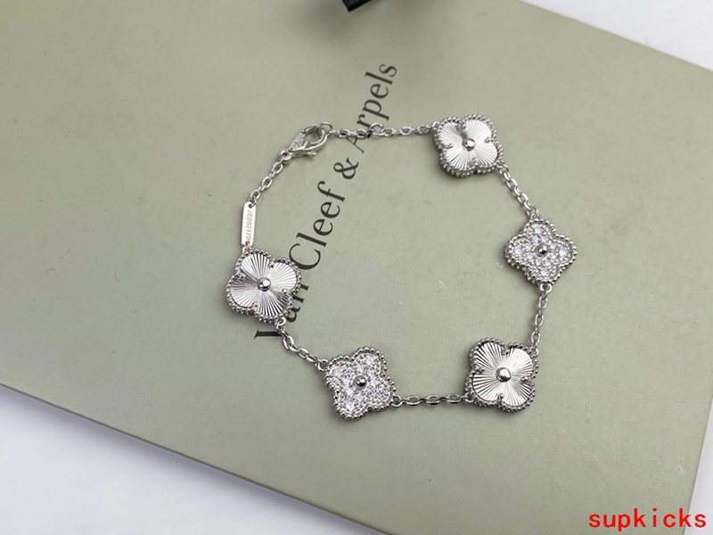 Lifestyle view of Van Cleef & Arpels unisex jewelry piece