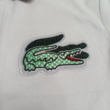 Side profile of Lacoste luxury clothing with tailored silhouette
