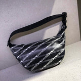 Side profile of classic sleek women's handbag – women's luxury accessory