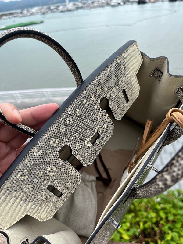Side view of poised structured handbag