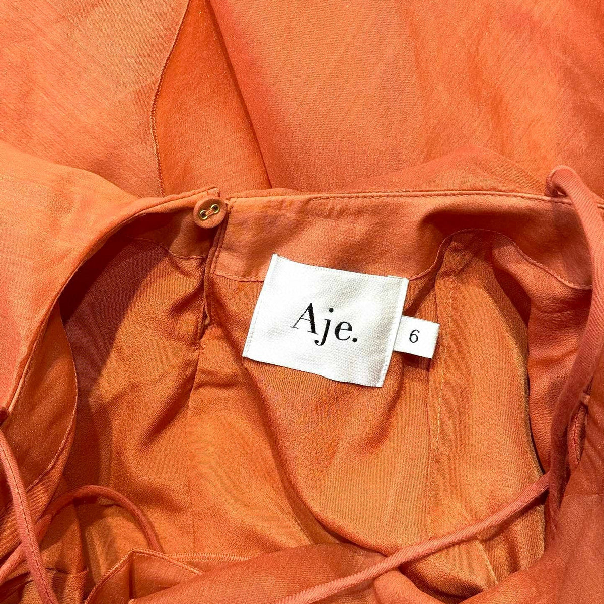 Aje Dress detail shot – authentic designer craftsmanship
