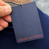 Close-up detail shot of Louis Vuitton luxury clothing with streetwear-inspired cut