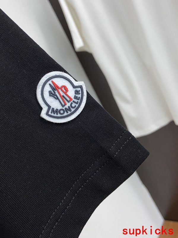 Flat lay presentation of Moncler luxury clothing with relaxed-fit cut